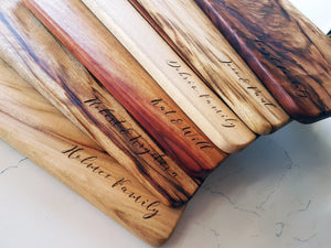 Bulk quantity of cutting boards with engraved text for clients 